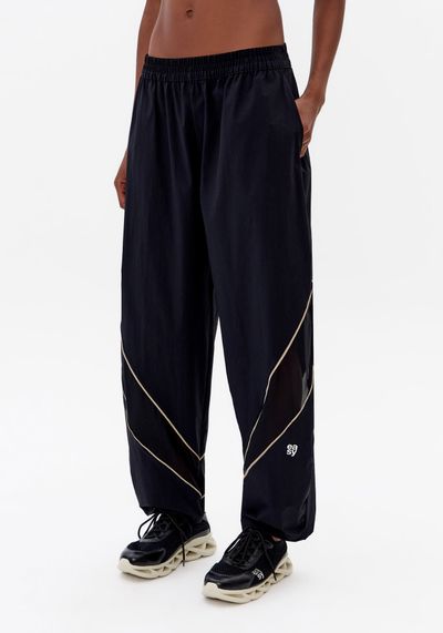 Calça Corta Vento Com Contraste